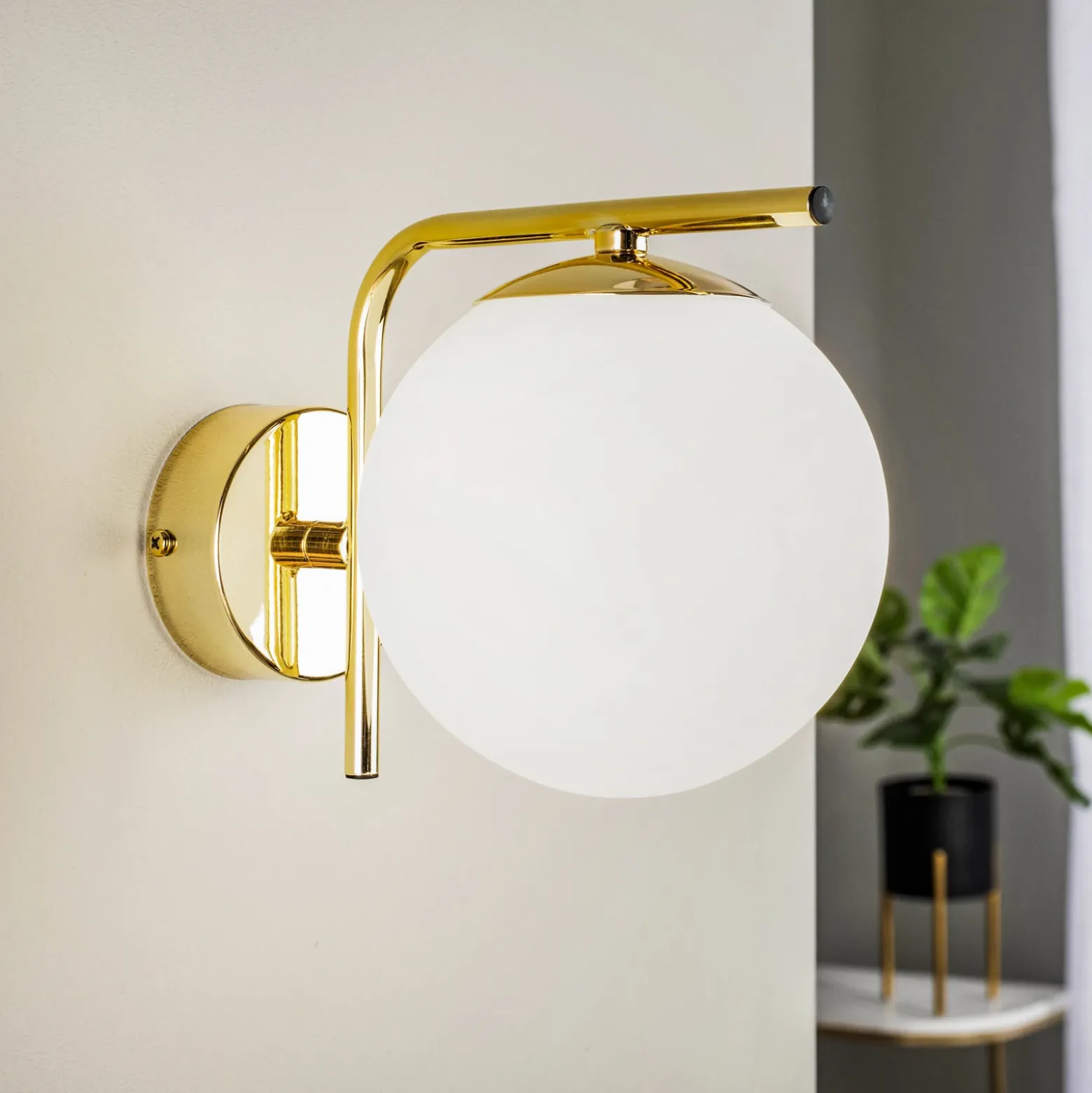 Aplique de pared Aurora, dorado, cristal, 17 cm de alto, esférico, E14