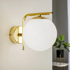 Aplique de pared Aurora, dorado, cristal, 17 cm de alto, esférico, E14