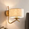 Aplique de pared Kaszmir Ecrie, dorado/beige, acero, tejido, E27