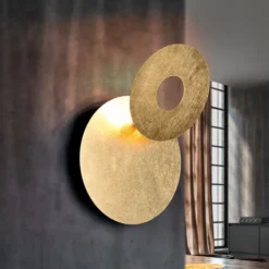 Aplique de pared LED Leano, lente redonda, dorado, indirecto