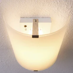Aplique de pared LED Lindby Helmi, altura 21 cm, cristal, semicircular