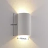 Aplique de pared LED Lindby Jenke, altura 16 cm, blanco, escayola