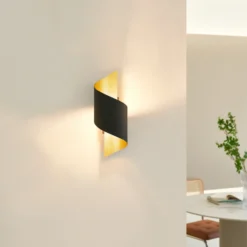 Aplique de pared Lindby Desirio, negro/oro, 24cm, metal
