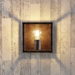 Aplique de pared Lindby Emin, ancho 18 cm, color óxido, metal