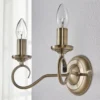 Aplique de pared Lindby Marnia, latón envejecido, 2 luces, 27 cm, E14