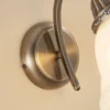 Aplique de pared Lindby Mialina, 20 cm, latón antiguo, metal, cristal