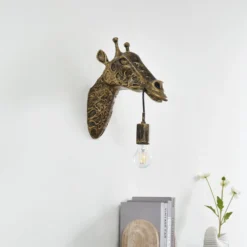 Aplique de pared Lindby Nirvathia, 35 cm, jirafa, color latón