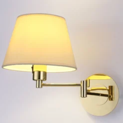 Aplique de pared Lindby Pola, 30 cm, latón, extensible, tela
