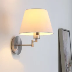 Aplique de pared Lindby Pola, 30 cm, níquel, extensible, textil