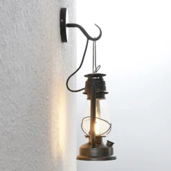 Aplique de pared Lindby Raisa, color óxido, metal, farol, E14