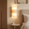Aplique de pared Nature, color crema, altura 40 cm, tejido, luz hacia