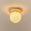 Aplique de pared Nuura Liila 1 Medium, dorado/amarillo miel, IP44, G9