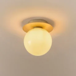 Aplique de pared Nuura Liila 1 Medium, dorado/amarillo miel, IP44, G9