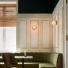 Aplique de pared Nuura Liila 1 Medium, dorado/rosa, IP44, G9