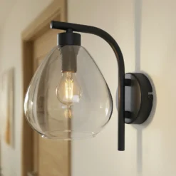 Aplique de pared Pendura de Lindby, Ø 15 cm, negro, cristal
