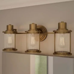 Aplique de pared Riggs IP44, latón envejecido, 3 luces