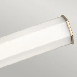 Aplique LED para baño Facet Dual, latón, 2 luces, ancho 66 cm