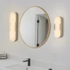 Aplique LED para baño Opaline Altura 35 cm Color dorado Metal/resina