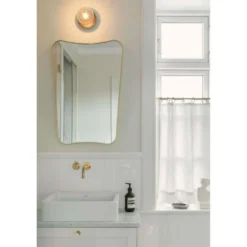 Aplique Nuura Liila 1, Ø 14 cm, IP44, bronce/transparente
