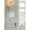Aplique Nuura Liila 1, Ø 14 cm, IP44, bronce/transparente