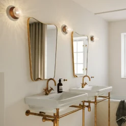 Aplique Nuura Liila 1, Ø 14 cm, IP44, bronce/transparente
