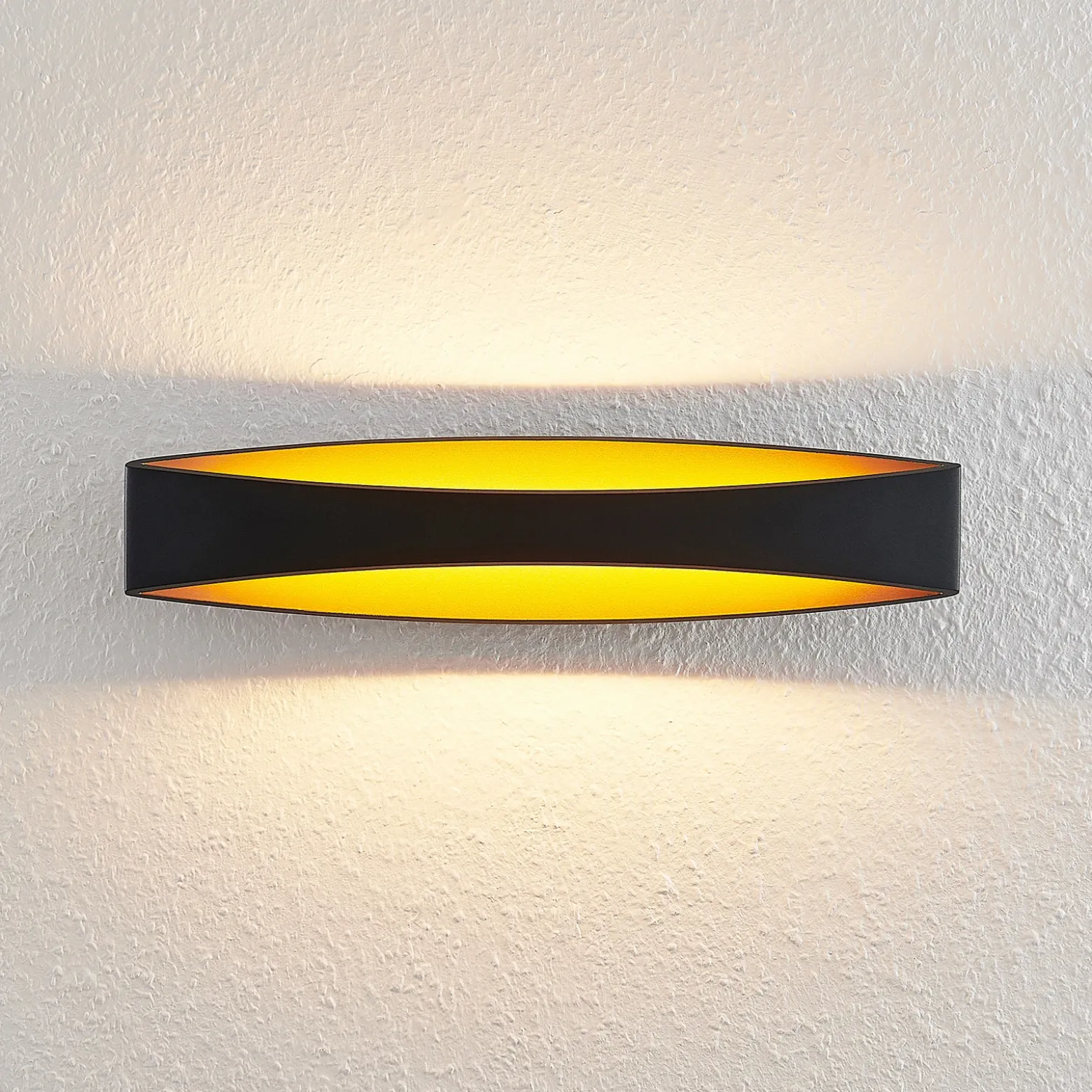 Arcchio Aplique de pared LED Jelle, 44 cm, negro/oro, arriba/abajo