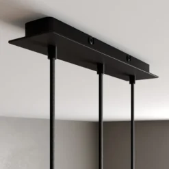 Arcchio Lámpara colgante LED Franka, 3 luces, larga, negra, aluminio