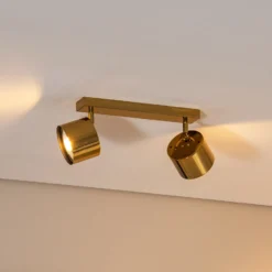 Downlight Chloe orientable, 2 luces, acero color latón