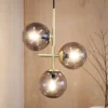 Dyberg Larsen Lámpara colgante Como, 3 luces, latón