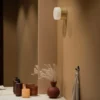 Globen Lighting: aplique para baño «Hubble 12» en latón, Ø 12 cm