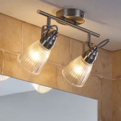 Lindby Aplique para baño Kara, 31 cm, 2 luces, cristal, IP44, G9