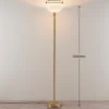 Lindby lámpara de pie Ignacia, color latón, cristal, 180 cm, E27