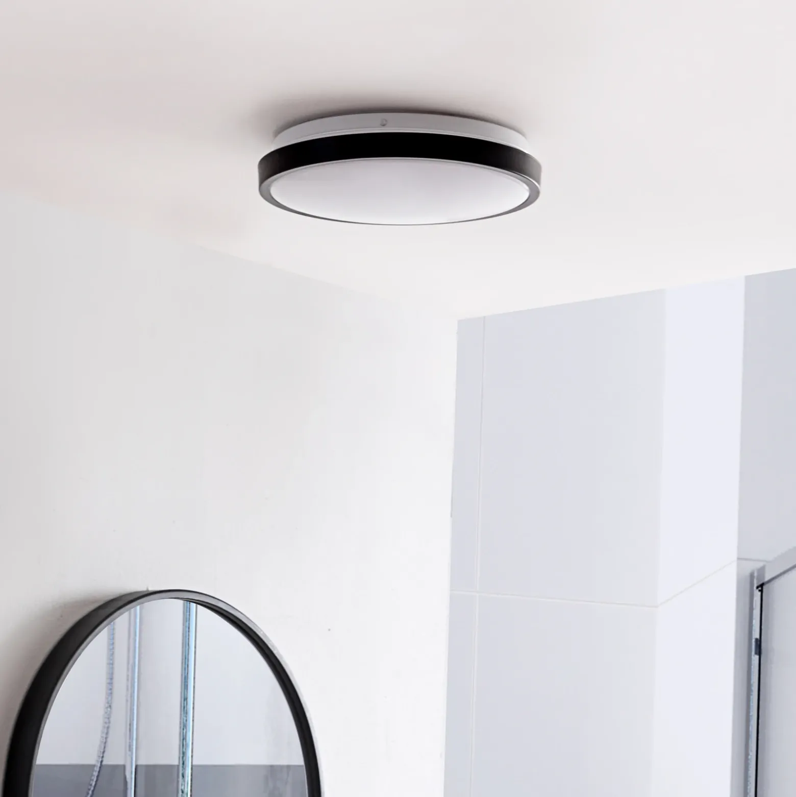 Lindby Lámpara de techo LED Medon Ø 29 cm plástico negro IP44