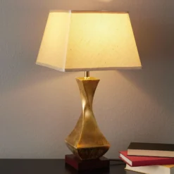Llamativa lámpara de sobremesa Deco, base dorada