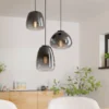 Lámpara colgante Aguilares, cristal ahumado, rondel de 3 luces