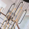 Lámpara colgante LED Colette, 14 lámparas, negro/oro rosa, redonda