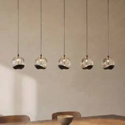 Lámpara colgante LED Lucande Hayley, negra, 5 luces, alargada