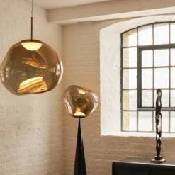 Lámpara colgante LED Melt de Tom Dixon, Ø 28 cm, color bronce