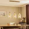 Lámpara colgante Lindby Drakar, 3 luces, ámbar, cristal, Ø 19,5 cm