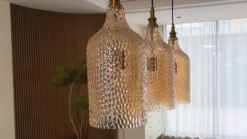 Lámpara colgante Lindby Drakar, 3 luces, ámbar, cristal, Ø 19,5 cm