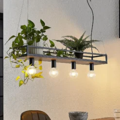Lámpara colgante Lindby Kirista, 4 luces, negro/madera, 100 cm, E27
