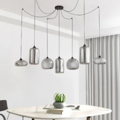 Lámpara colgante Lindby Marla, 7 luces, cristal, gris ahumado, 128cm