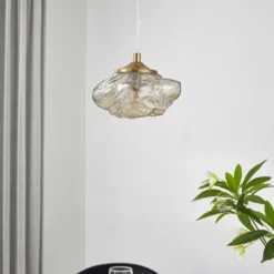 Lámpara colgante Lindby Piatra, ámbar/latón, cristal, Ø 16 cm, G9