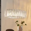 Lámpara colgante Lindby Sofia, 68 cm, 3 luces, E14, cromo/claro