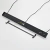 Lámpara colgante Lindby Tarjei, longitud 120cm, negro/oro, metal