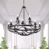 Lámpara de araña Cartwheel III, 12 luces, Ø 89cm, negra, metal