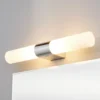 Lámpara de espejo Ziva de Lindby, enchufe, blanco, cristal, IP44