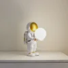 Lámpara de mesa Kosmo de Lindby, blanco/dorado, cerámica, vidrio