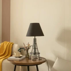 Lámpara de mesa Lindby Croia, negra, metal, Ø 28 cm, E27
