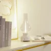 Lámpara de mesa Lindby LED recargable Maxentius, crema, cristal, atenuador